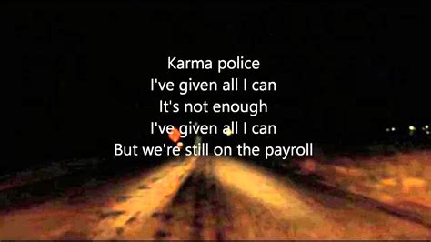 Karma Police - melancholijny utwór z tekstami o surrealistycznych wątkach i mocnym brzmieniem gitarowym